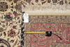 Load image into Gallery viewer, Decorative rug with intricate patterns and a measuring tape for scale.