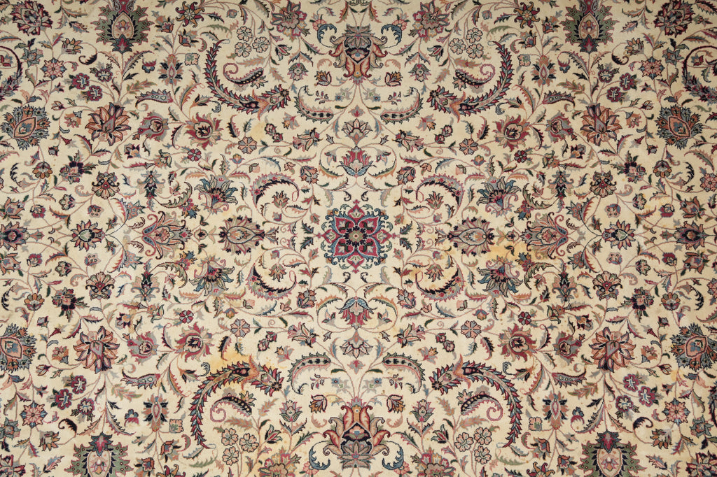Close-up of a patterned rug with intricate designs on a beige background