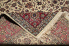 Load image into Gallery viewer, Close-up of a patterned rug with intricate designs and fringes.