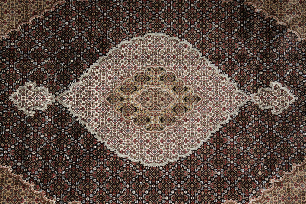 Close-up of a patterned rug with intricate designs.