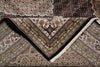 Load image into Gallery viewer, Close-up of a patterned rug with intricate designs.