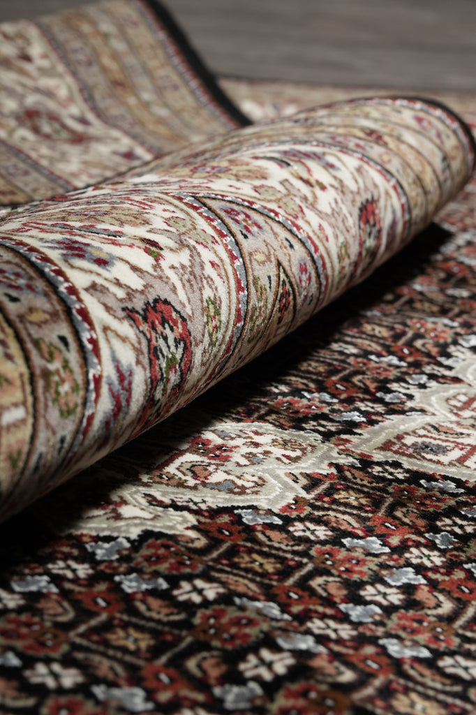 Close-up of a patterned rug with a focus on texture and color.