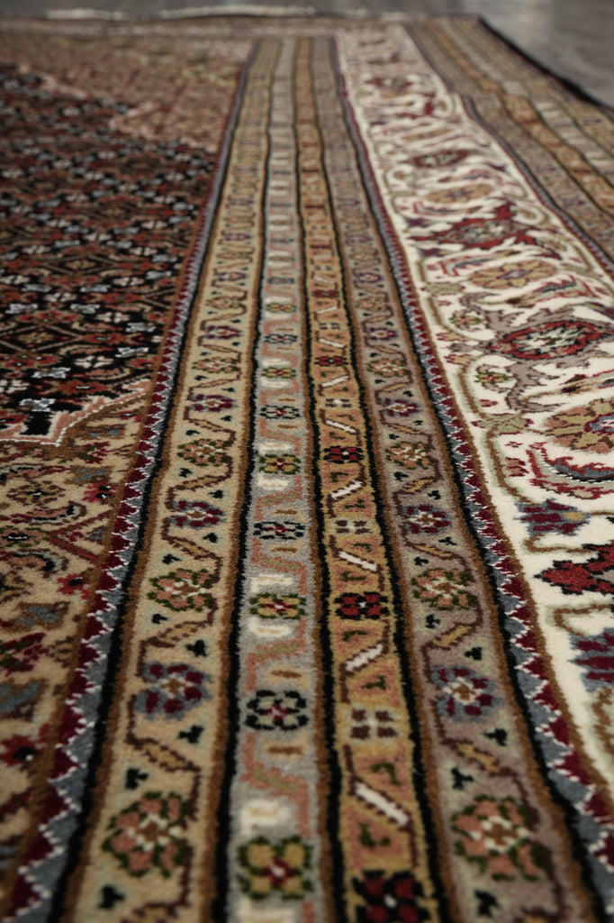 Close-up of a patterned rug with intricate designs.