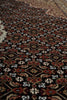 Load image into Gallery viewer, Close-up of a patterned fabric with intricate designs.