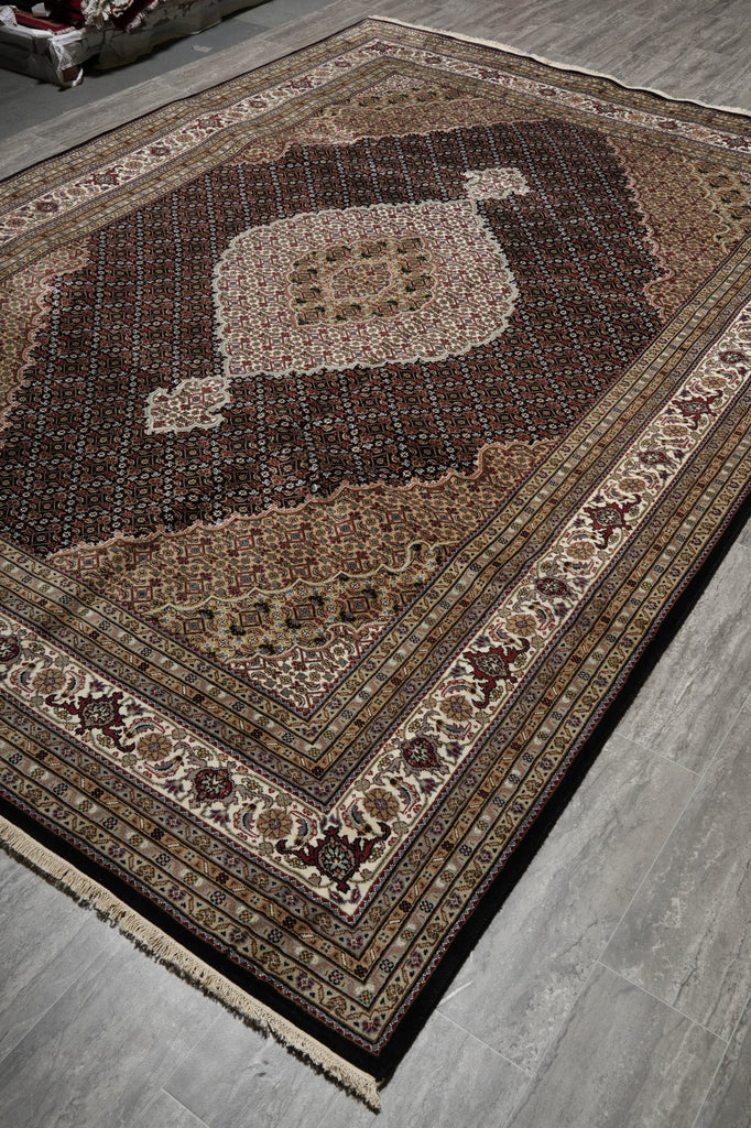 Decorative rug with intricate patterns on a wooden floor
