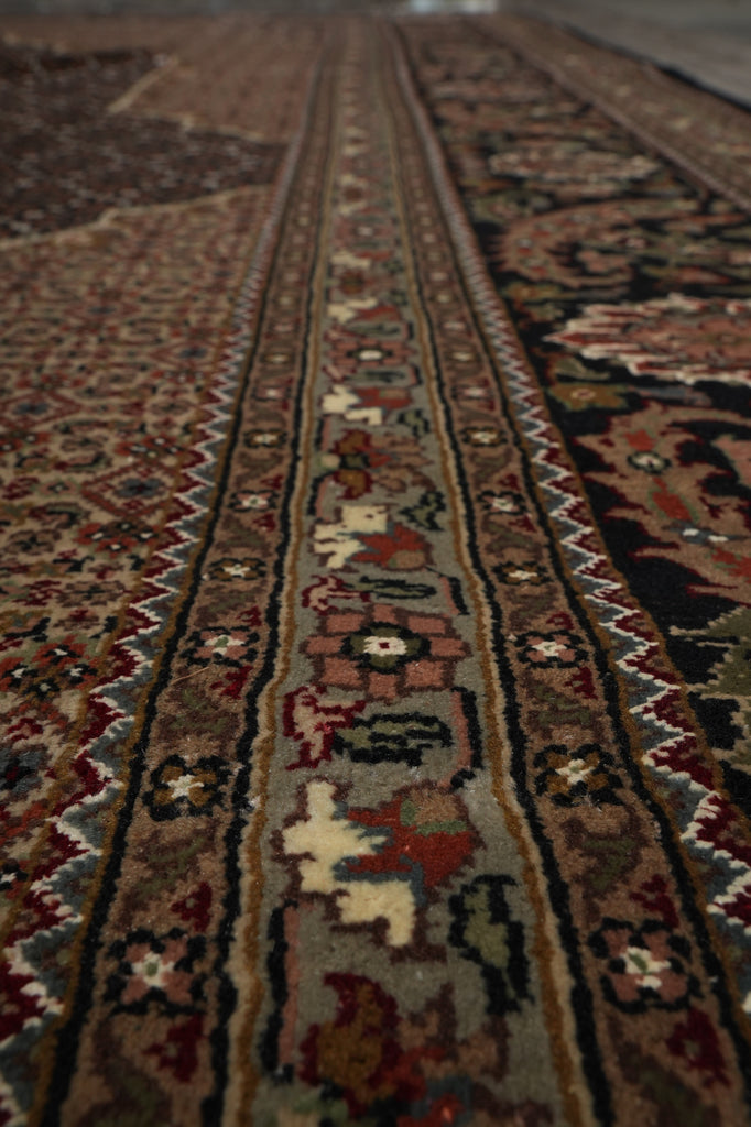 Close-up of a patterned rug with intricate designs.