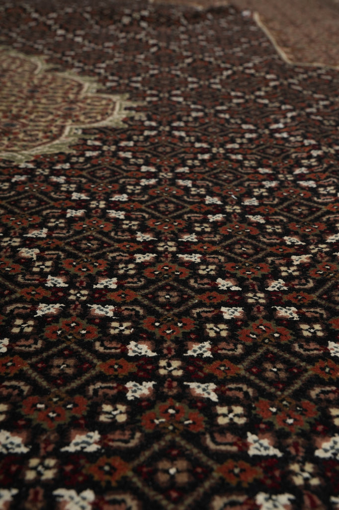 Close-up of a patterned rug with intricate designs.