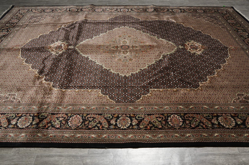 Decorative rug with intricate patterns on a wooden floor