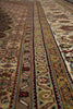 Load image into Gallery viewer, Close-up of a patterned rug with intricate designs.