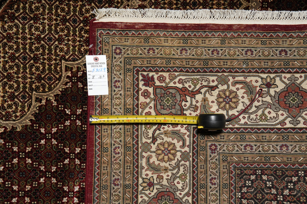 Decorative rug with a measuring tape on top, showing dimensions.
