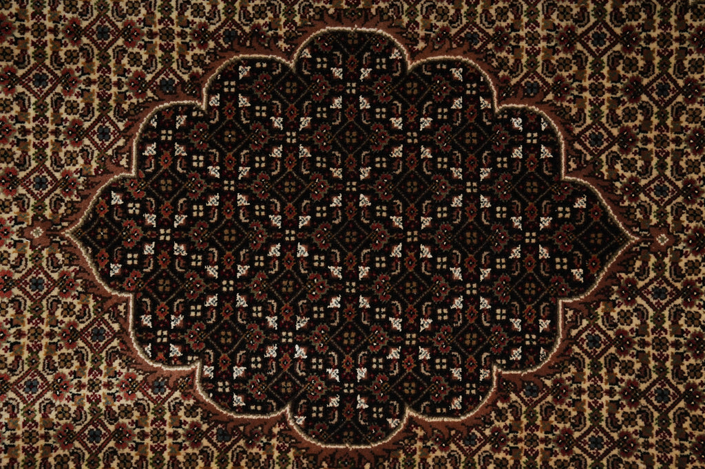 Close-up of a patterned rug with intricate designs.