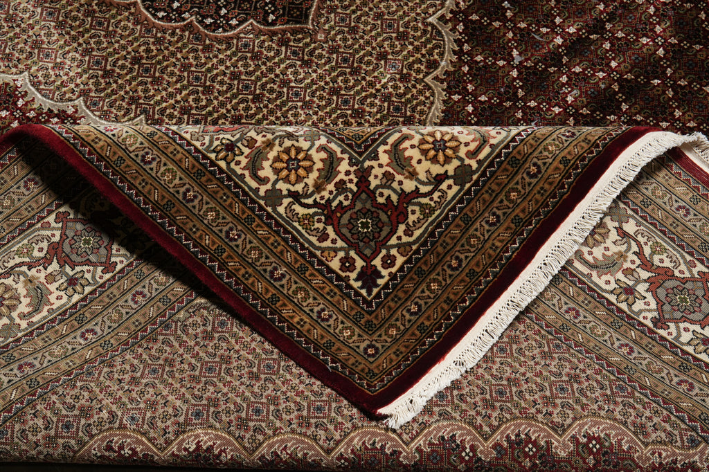 Close-up of a patterned rug with intricate designs.