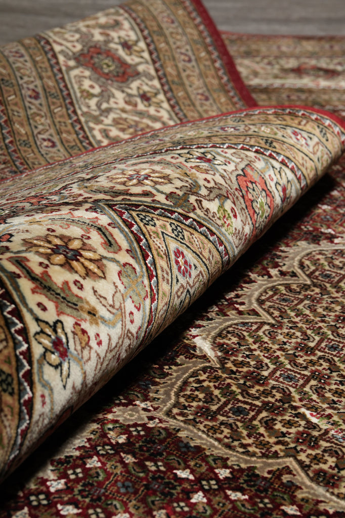 Close-up of a patterned rug with intricate designs.