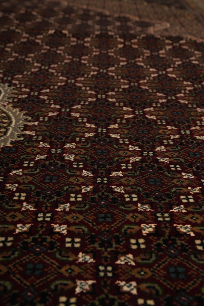 Close-up of a patterned rug with intricate designs.