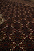 Load image into Gallery viewer, Close-up of a patterned rug with intricate designs.