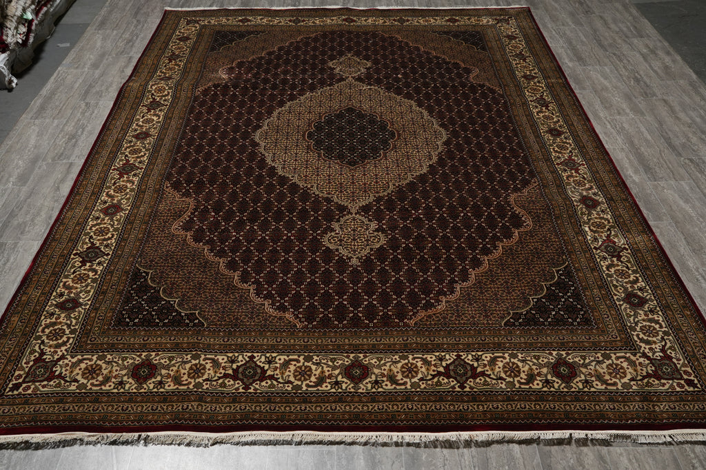 Decorative rug with intricate patterns on a wooden floor