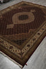 Load image into Gallery viewer, Decorative brown rug with intricate patterns on a gray floor.