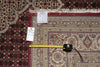 Load image into Gallery viewer, Patterned rug with a measuring tape and price tag on it
