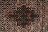 Load image into Gallery viewer, Close-up of a patterned rug with intricate designs.