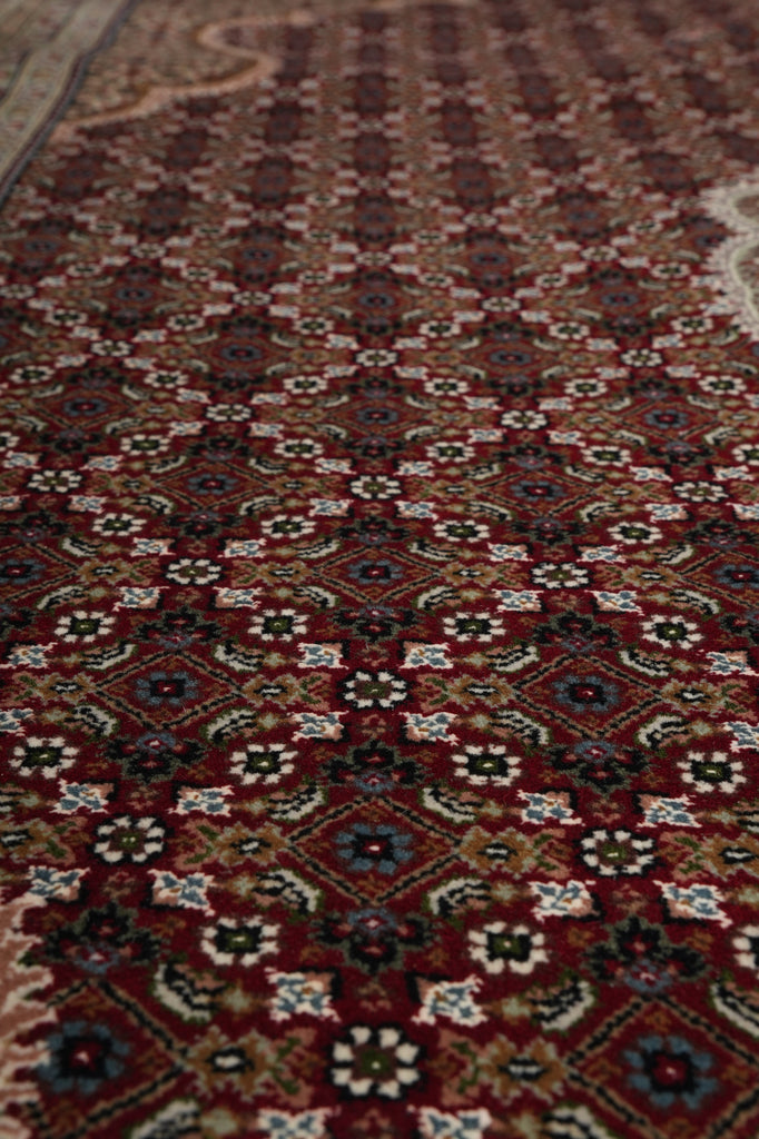 Close-up of a patterned rug with intricate designs.