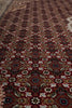 Load image into Gallery viewer, Close-up of a patterned rug with intricate designs.