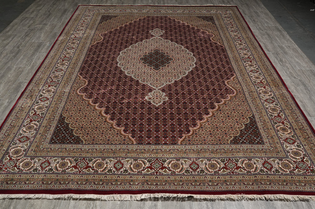 Decorative rug with intricate patterns on a wooden floor