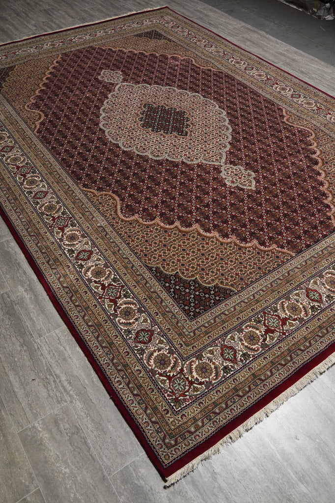 Decorative rug with intricate patterns on a wooden floor