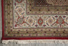 Load image into Gallery viewer, Close-up of a patterned rug with intricate designs on a concrete floor.