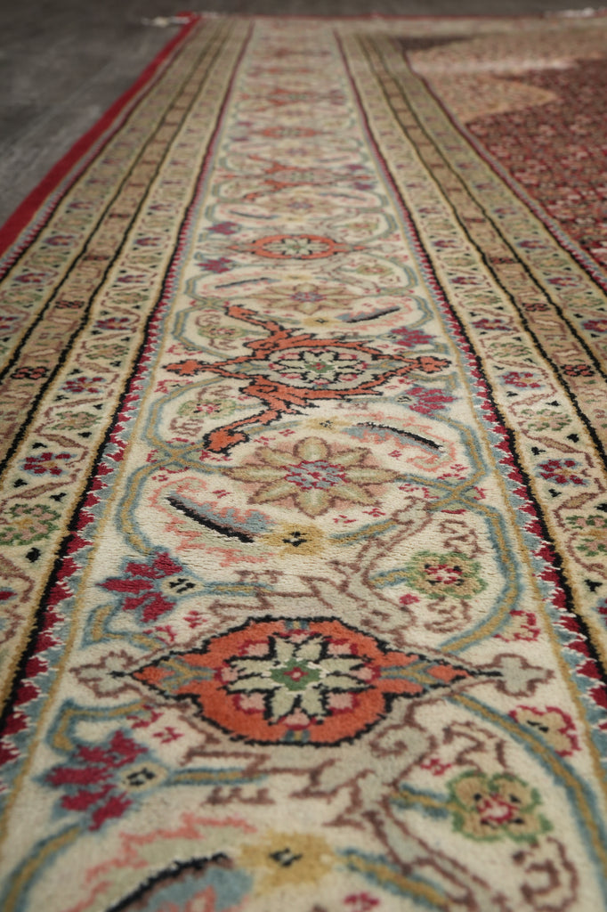Close-up of an intricately designed rug with floral patterns.