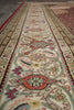Load image into Gallery viewer, Close-up of an intricately designed rug with floral patterns.
