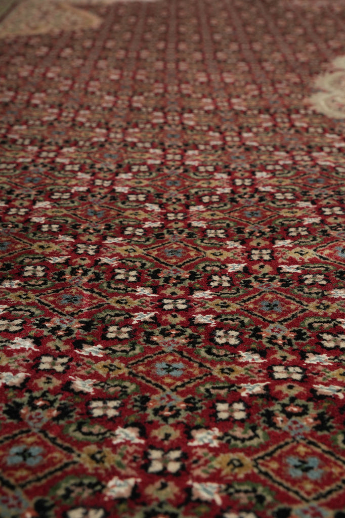 Close-up of a patterned rug with intricate designs.