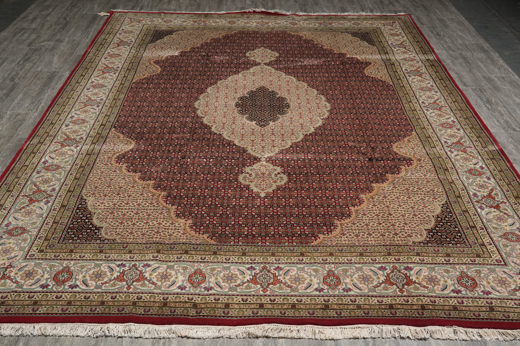 Decorative rug with intricate patterns on a wooden floor