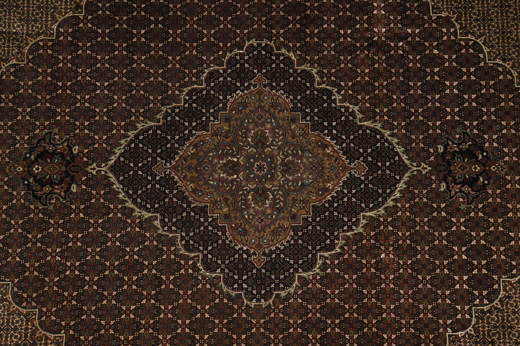 Close-up of a patterned rug with intricate designs.