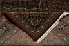 Load image into Gallery viewer, Close-up of a patterned rug with intricate designs and fringes.
