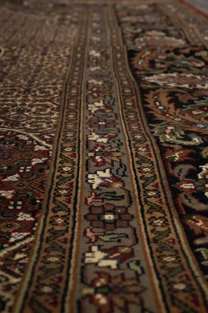 Close-up of an intricately patterned rug with detailed designs.