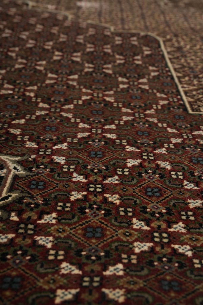 Close-up of a patterned rug with intricate designs.