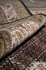 Load image into Gallery viewer, Close-up of patterned rugs with intricate designs on a neutral background