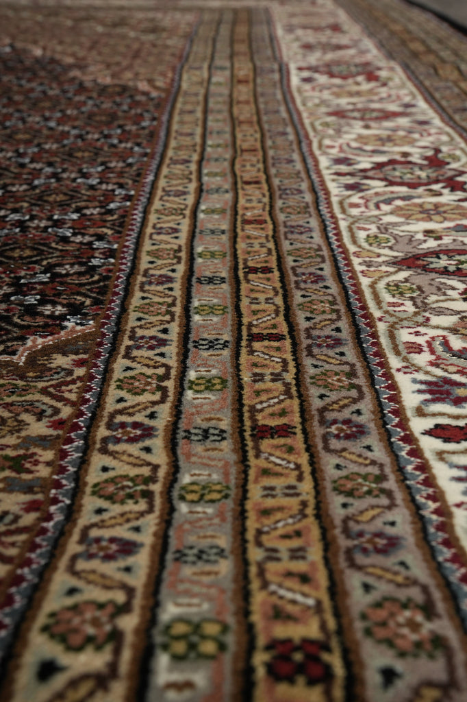 Close-up of a patterned rug with intricate designs.