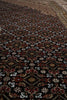 Load image into Gallery viewer, Close-up of a patterned rug with intricate designs.