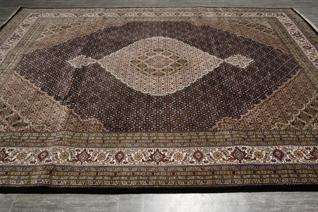 Decorative rug with intricate patterns on a wooden floor