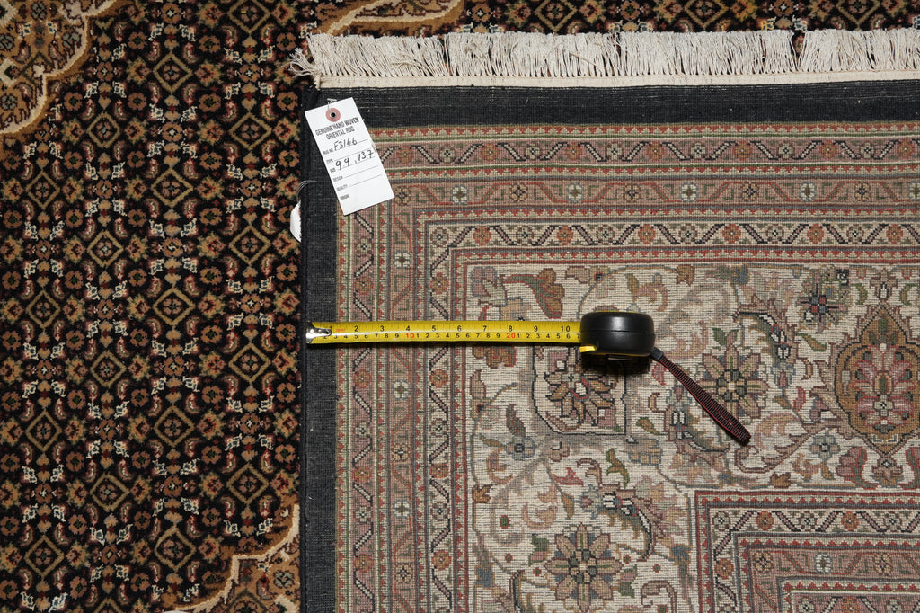Patterned rug with a measuring tape and a candle on top