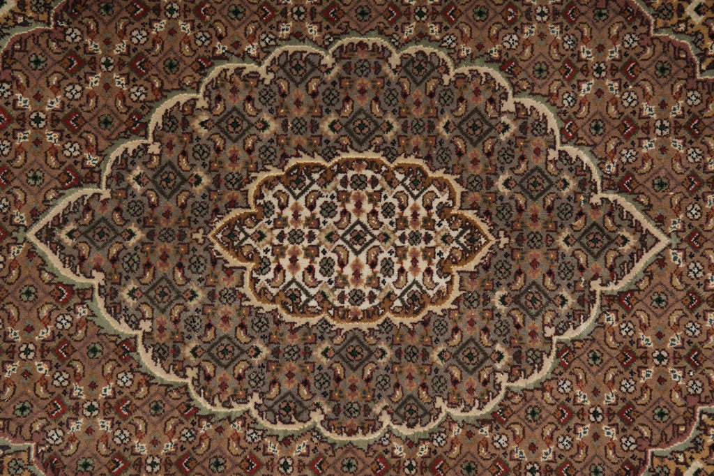 Close-up of a patterned rug with intricate designs