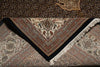 Load image into Gallery viewer, Close-up of a patterned rug with intricate designs and a black border.