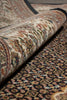 Load image into Gallery viewer, Close-up of a rolled-up patterned rug with intricate designs.
