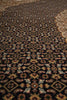Load image into Gallery viewer, Close-up of a patterned rug with intricate designs.