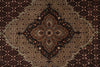 Load image into Gallery viewer, Close-up of a patterned rug with intricate designs.