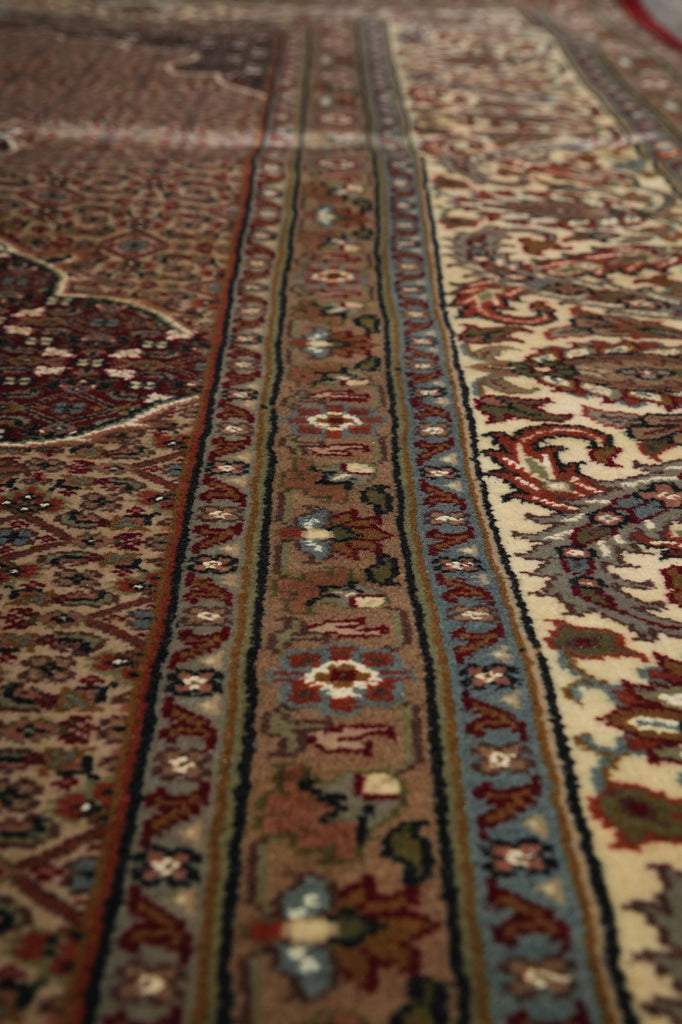 Close-up of an intricately patterned rug with detailed designs.