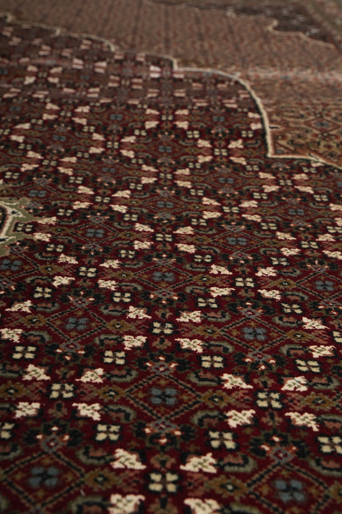 Close-up of a patterned rug with intricate designs.