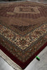 Load image into Gallery viewer, Close-up of a patterned rug with intricate designs on a plain background