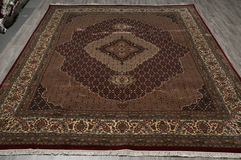 Decorative rug with intricate patterns on a wooden floor